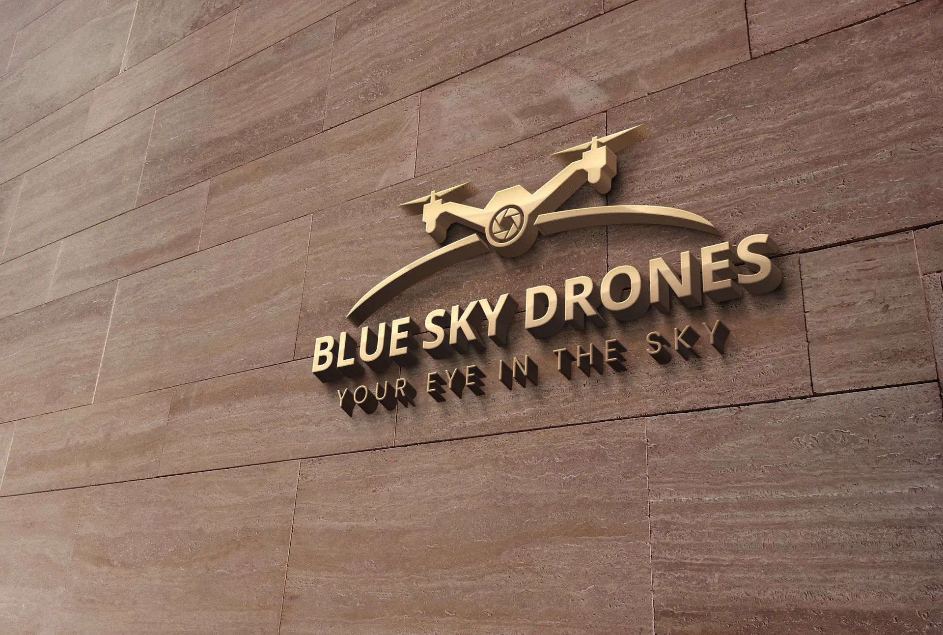 The Blue Sky Drones logo on a stone wall